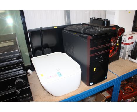 An HP monitor; an HP printer/scanner; an Advent computer lacking cable; keyboard; speakers etc.