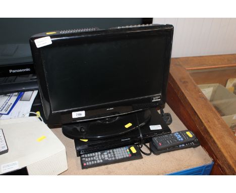 An Alba flatscreen television; Panasonic DVD player and various remote controls