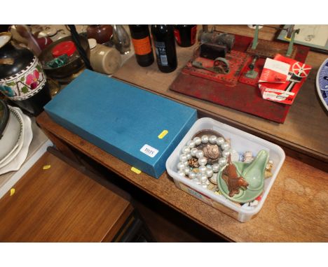 A box containing various Wade Whimsies and box set of glasses