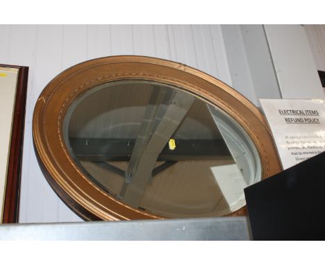 A gilt framed and bevel edge wall mirror