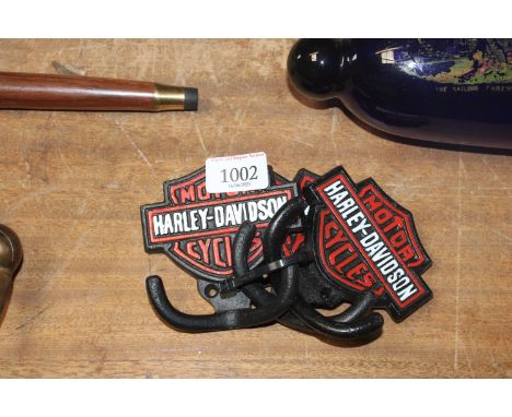 A set of three reproduction Harley Davidson coat hooks (96)