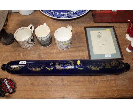 A blue glass rolling pin with painted decoration AF