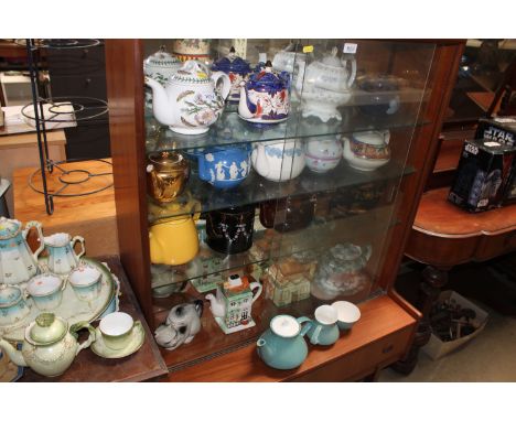 A collection of various porcelain teapots; to include Wedgwood Queen's ware, Portmeirion 'Botanic Garden'&nbsp; etc.