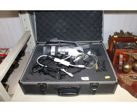 A Canon 3 CCD digital camcorder in fitted case with various accessories