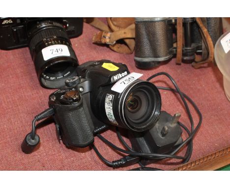 A Nikon Coolpix P510 digital camera and charger