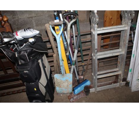 A collection of various long handled gardening tools, spirit level etc.