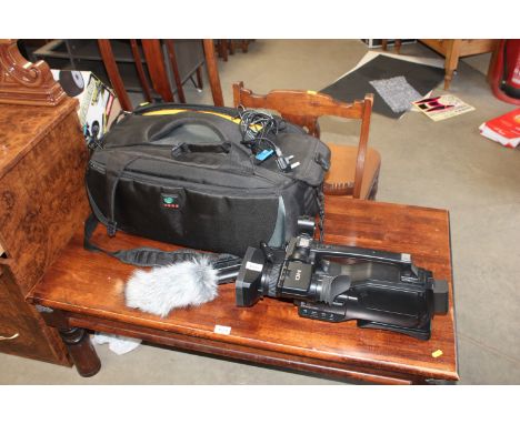 A Sony Optical Steadyshot Camcorder together with a microphone and various accessories