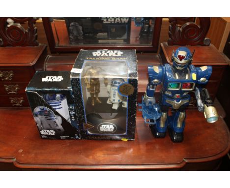 Two Star Wars figurines and a toy robot