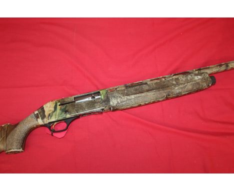 A 12 bore Fabarm self-loading shotgun finished in real tree camo. In original hard case with full set of chokes, Ser. No.7010