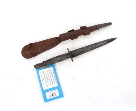 A late WWII F&S mark III fighting knife with scabbard (elastic broken and no markings) This item can only be purchased by som