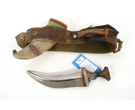 An Arabian Janbiyya dress dagger, mounted for wear within decorative belt.&nbsp;This item can only be purchased by someone ov