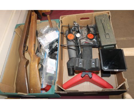 Two boxes of shooting related items including air rifle spares, target spotting scope and bench rest etc.