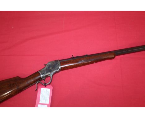 A Model 1886 falling block Winchester style rifle by Uberti, 30" octagonal barrel in .45 long Colt Cal. Ser. No.S-00599 in ov