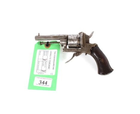 A six shot pin fire revolver in 7mm Cal. single and double action working but otherwise AF