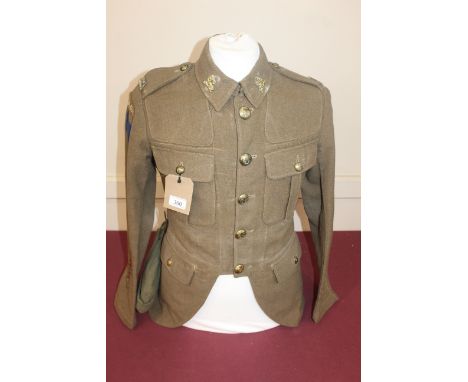 A WWII era Canadian jacket with insignia for the Essex &amp; Scottish Regiment, with an un-associated hat with Canada badge