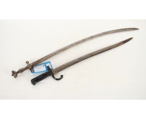 An Indian Talwar sword together with a relic M1866 French bayonet. This item can only be purchased by someone over the age of