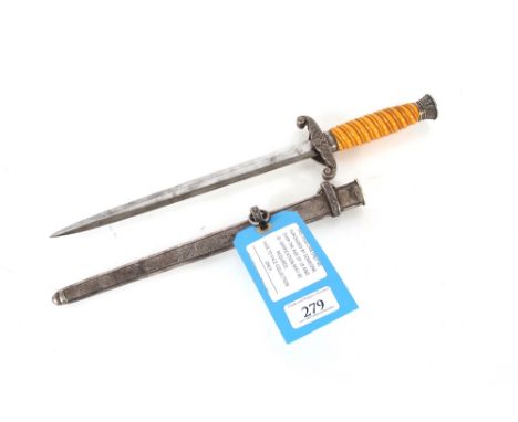 A Third Reich era army dress dagger with scabbard, an honest example but with eagle cross guard AF. This item can only be pur