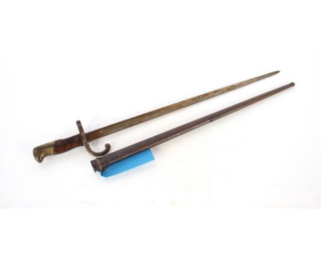 A French M1874 Gras bayonet (dated 1880) with scabbard. This item can only be purchased by someone over the age of 18 and ID 