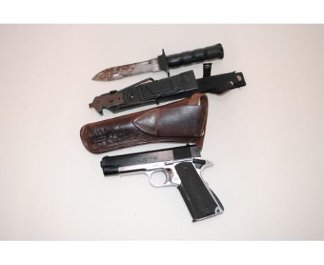 A plastic replica Colt pistol with a survival knife and a leather holster, both AF. This item can only be purchased by someon