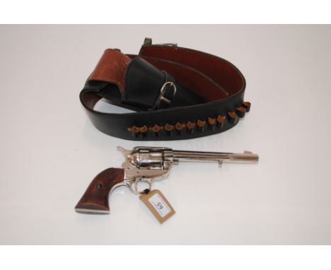 A replica Colt .45 revolver within a leather rig
