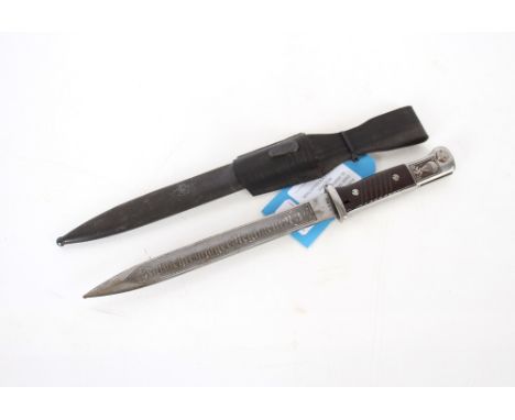 A Third Reich era K98 bayonet (dated 1943) with post war embellishment and frog. This item can only be purchased by someone o