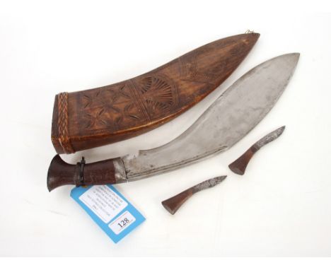A Large Kukri within AF carved wooden sheath. An interesting example, Possible ceremonial use. This item can only be purchase