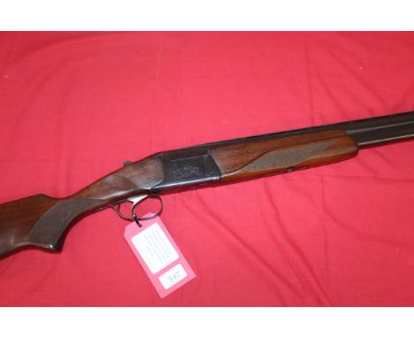 A 12 bore over and under shotgun by Baikal with 27½" barrels having good bores, ejector model with single trigger. A good cle