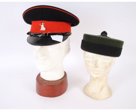 A Norfolk Regiment peaked cap with badge together with a Gurka pill box hat (2)