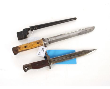 A British No.4 spike bayonet with scabbard, together with a No.5 bayonet and a German bayonet both without scabbards and AF T