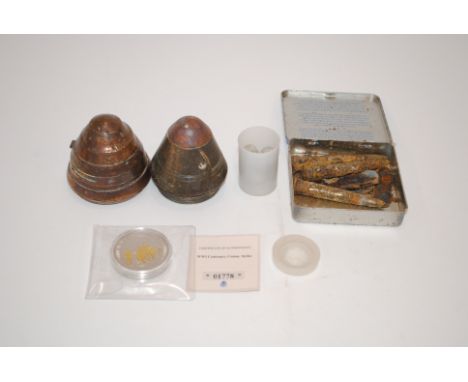 Two WWI era shell fuses with relic rifle rounds, musket balls and a commemorative medallion (Xmas 1914 Truce)