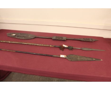 Two good Ethnic spears with an AF carved wooden paddle. This item can only be purchased by someone over the age of 18 and ID 