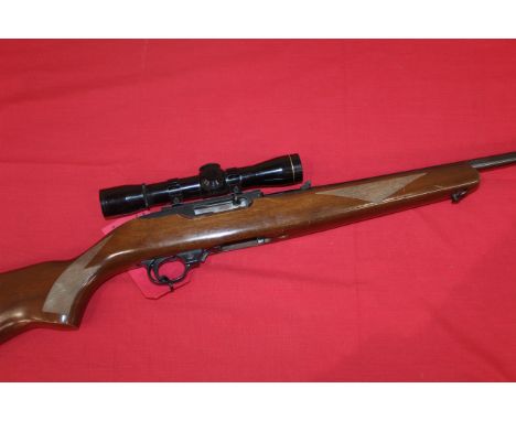 A Ruger 10/22 .22 rim fire Cal. self loading rifle Ser. No. 251-88873 with leopold scope and two magazines and sound moderato