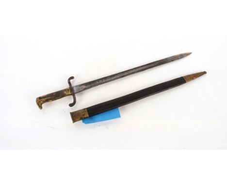 A Prussian model 1871 brass hilted bayonet, blade with some corrosion and unit marked scabbard with stitching AF. This item c