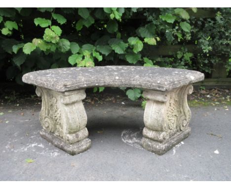 A composition Garden Bench, crescent shaped, 3ft 4in W