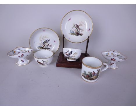 A pair of 18th Century Ansbach Cups and Saucers painted birds perched on branches amongst scattered puce floral sprigs, a pai