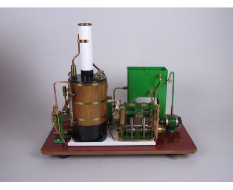 A Stationary Engine by Cheddar Models Ltd with vertical boiler within carrying case, 15 x 13in