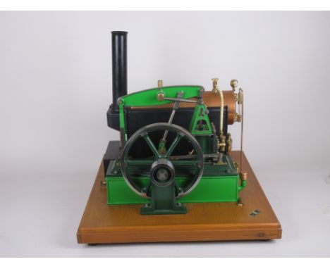 A Beam Engine by Stuart Models in green livery with copper horizontal boiler on wooden plinth, 16 x 16in