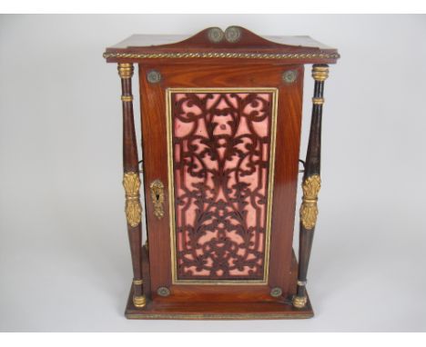 A 19th Century French Gem Collector's Cabinet in kingwood having gilt mounted door with fretwork panel enclosing 20 small dra