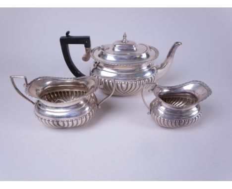 A Victorian silver three piece Tea Service of semi-fluted boat shape, Chester 1896