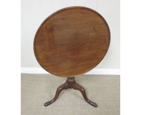 A George III mahogany Pillar Table with dished circular one piece top, bird cage support on turned column and tripod base, 2f