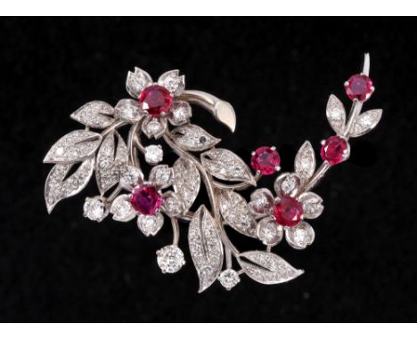 A Ruby and Diamond Flower Spray Brooch claw-set six round rubies among numerous claw and pavé-set brilliant and eight-cut dia
