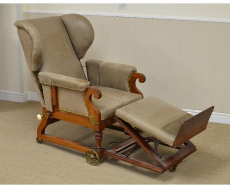 A 19th Century mahogany leather covered Invalid's Chair, the adjustable wing back and folding arms above a stuff over seat an