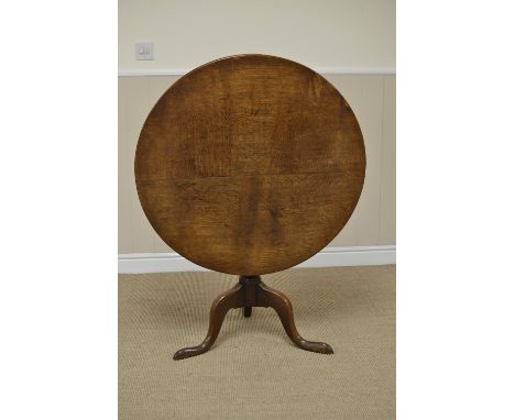 A Georgian oak Pillar Table with circular top on baluster column and tripod base, 2ft 8 1/2 in D