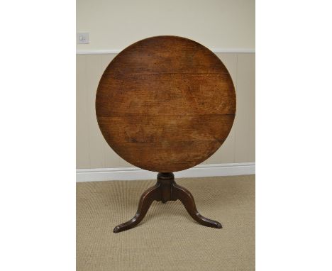 A Georgian oak Pillar Table with circular top on vase turned column and tripod base, 2ft 8in D