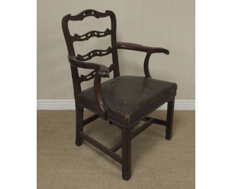 A George III mahogany ladderback Armchair, with pierced crossrails, scrolled arms, stuffover seat, caddy moulded square legs 