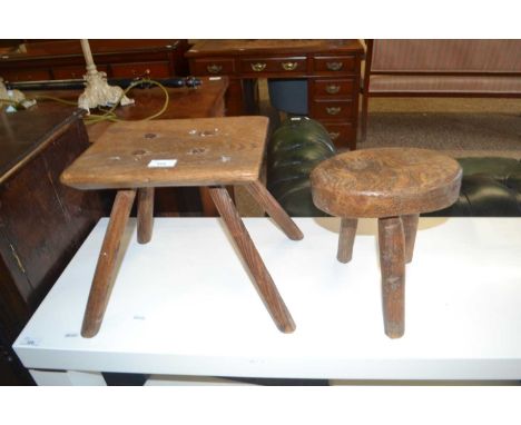 Two vintage elm topped milking stools, largest 30cm wide