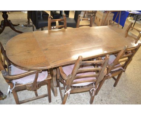 Modern oak drop leaf dining table with a set of six ladder back dining chairs