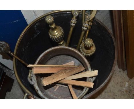 Copper coal bucket together with a selection of various brass fire tools