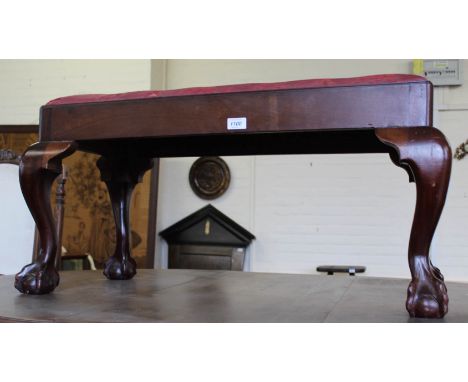 A late Victorian mahogany stool on ball and claw feet