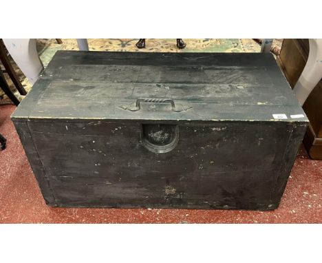 Dark pine trunk with cast iron handle to lid 